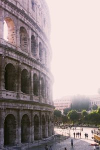 Vertical shot of the great Roman Coliseum on a sunny day