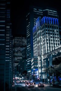 Night buildings with lights and cars at night in Montreal