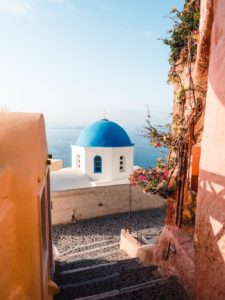 Vertical shot of a blue dome at Santorini, Greece